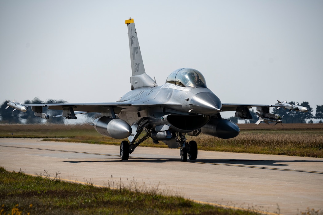 A U.S. Air Force F-16 Fighting Falcon  assigned to the 35th Fighter Squadron taxis in  during Freedom Flag 25-2 at Kunsan Air  Base, Republic of Korea, Nov. 4, 2025. FF  25-2 is a routine event conducted to maintain  readiness and enhance joint and bilateral  partnerships.