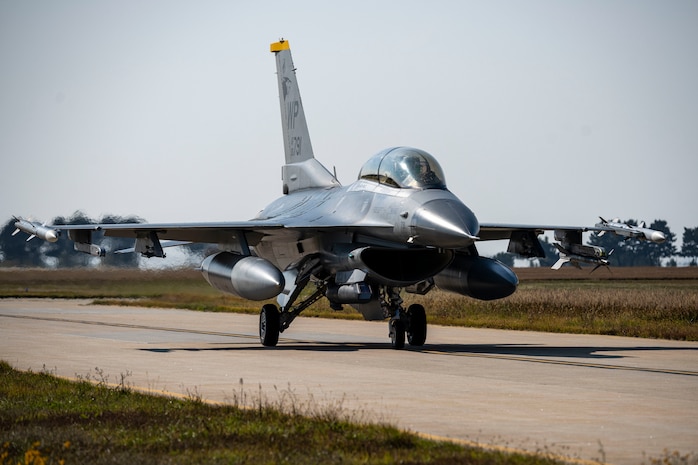 A U.S. Air Force F-16 Fighting Falcon  assigned to the 35th Fighter Squadron taxis in  during Freedom Flag 25-2 at Kunsan Air  Base, Republic of Korea, Nov. 4, 2025. FF  25-2 is a routine event conducted to maintain  readiness and enhance joint and bilateral  partnerships.