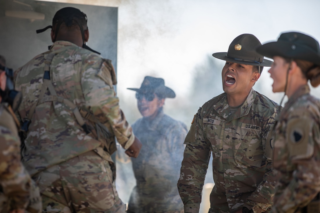 Army Reserve Best Squad competitors run inside a dark smoke filled room where they are tasked to memorize items on a table during the mystery event at Fort McCoy Wisconsin, May 10, 2025. Soldiers from around the nation compete in the 2025 BSC, an annual competition that brings together the best Soldiers and squads from across the U.S. Army Reserve to earn the title of “Best Squad” among their peers. (U.S. Army Reserve photo by Staff Sgt. Mikayla Fritz)
