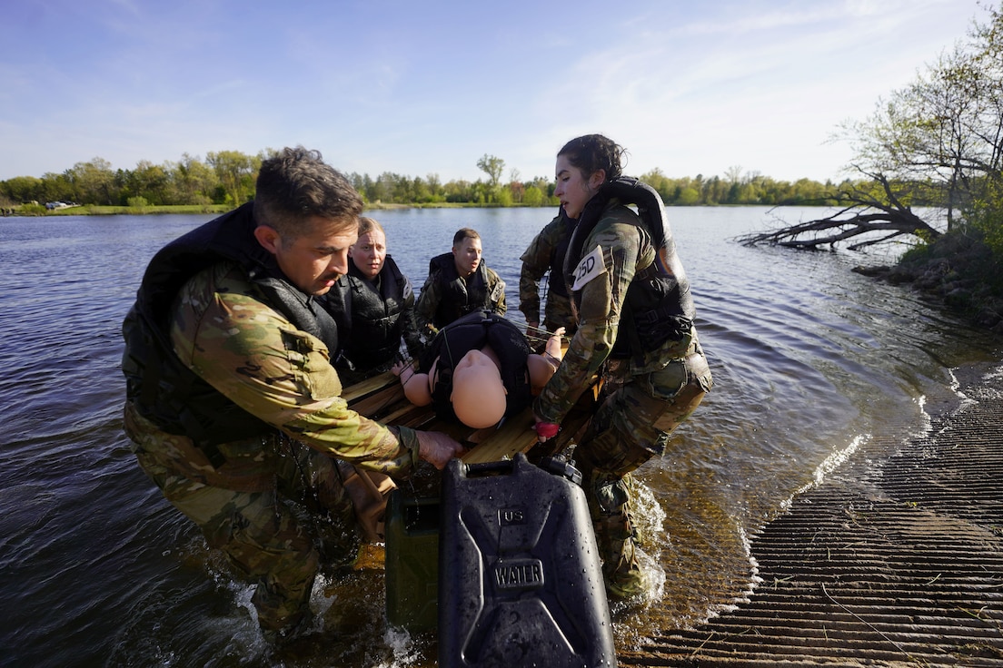 Army Reserve Best Squad competitors from the Army Reserve Medical Command complete the engineer swim event at Fort McCoy, Wisconsin, May 12, 2025. More than 60 Soldiers from around the nation are competing in the 2025 BSC, an annual competition that brings together the best Soldiers and squads from across the U.S. Army Reserve to earn the title of “Best Warrior” and “Best Squad” among their peers. (U.S. Army Reserve photo by Sgt. 1st Class Crystal Harlow)