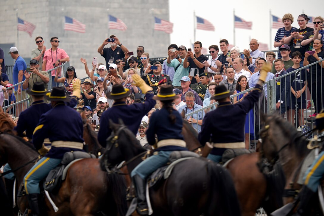 Soldiers wave to the crowd during the 250th Army Birthday Parade in Washington, D.C., June 14, 2025. (U.S. Army photo by Sgt. 1st Class Crystal Harlow)