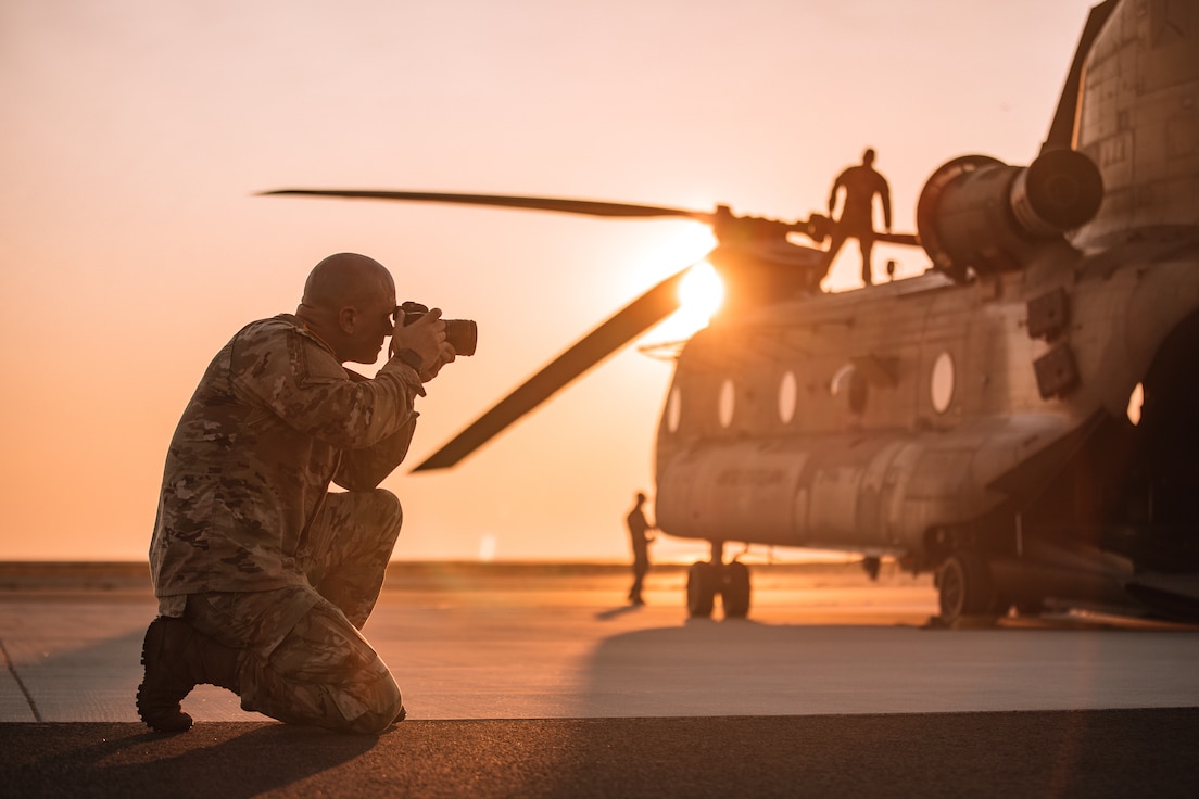 U.S. Army soldier, Staff Sgt. Eric Kestner, assigned to 982nd Combat Camera Company (Airborne), documents U.S. Army, Air Force and International Paratroopers as they prepare to conduct a foreign wing static line jump from a CH-47 Chinook helicopter onto Glen Rock Drop Zone during Leapfest in West Kingston, Rhode Island, July 28 to Aug. 4, 2025. Leapfest is the largest, longest standing, international static line parachute training event and competition hosted by the 56th Troop Command, Rhode Island Army National Guard to promote high level technical training and esprit de corps within the International Airborne community. (U.S. Army Reserve photo by Sgt. Kelsey Kollar)