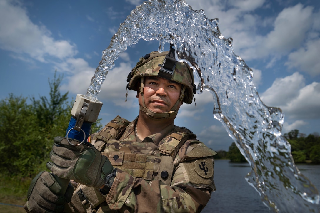U.S. Army Reserve Spc. Jose Marim with the 426th Quartermaster Company operates a water purification system at Global Strike 2025 during the Combat Support Training Exercise (CSTX) at Fort McCoy, Wisconsin, Aug. 7. The CSTX prepares Army Reserve units for deployment by providing realistic, externally evaluated, and collective training scenarios. (U.S. Army Reserve photo by Staff Sgt. Philip Ribas)