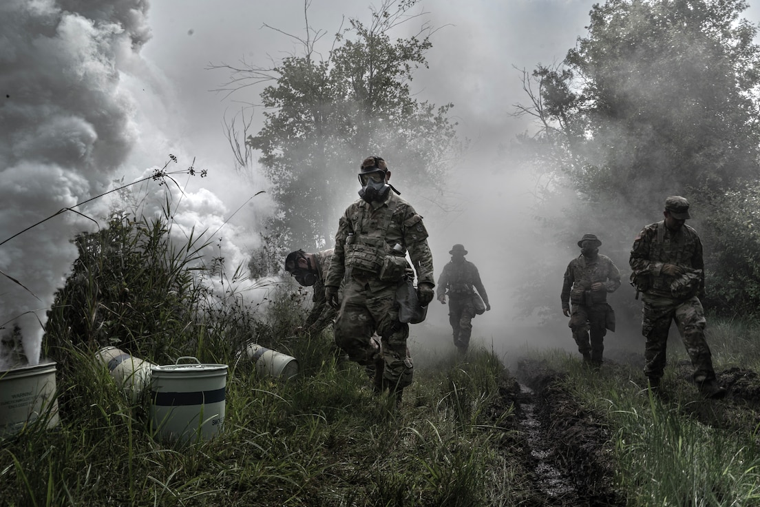 U.S. Army Reserve Soldiers from the 351st Ordnance Company provide smoke coverage as engineers construct a multi-role bridge to cross a wet gap at Global Strike 2025 during the Combat Support Training Exercise (CSTX) at Fort McCoy, Wisconsin, Aug. 11. The CSTX prepares Army Reserve units for deployment by providing realistic, externally evaluated, and collective training scenarios. (U.S. Army Reserve photo by Staff Sgt. Philip Ribas)