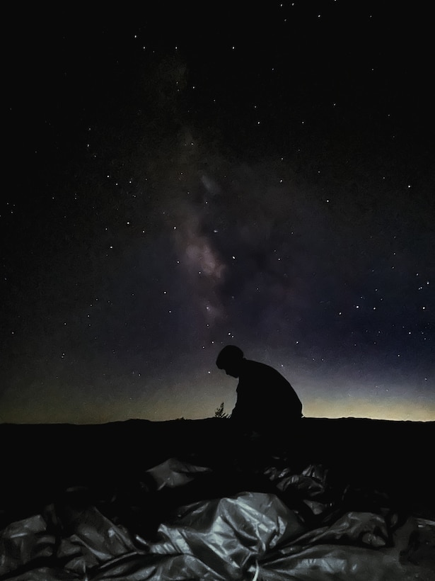 U.S. Army paratroopers assigned to the National Training Center, Operations Group, Tarantula Team, perform nighttime airborne operations at Calvin Drop Zone, Fort Irwin, Ca., Sept. 23, 2025. NTC conducted its final airborne operations that day, having been a key site for airborne training and readiness since 1987. (U.S. Army photo by Sgt. Kelsey Kollar)