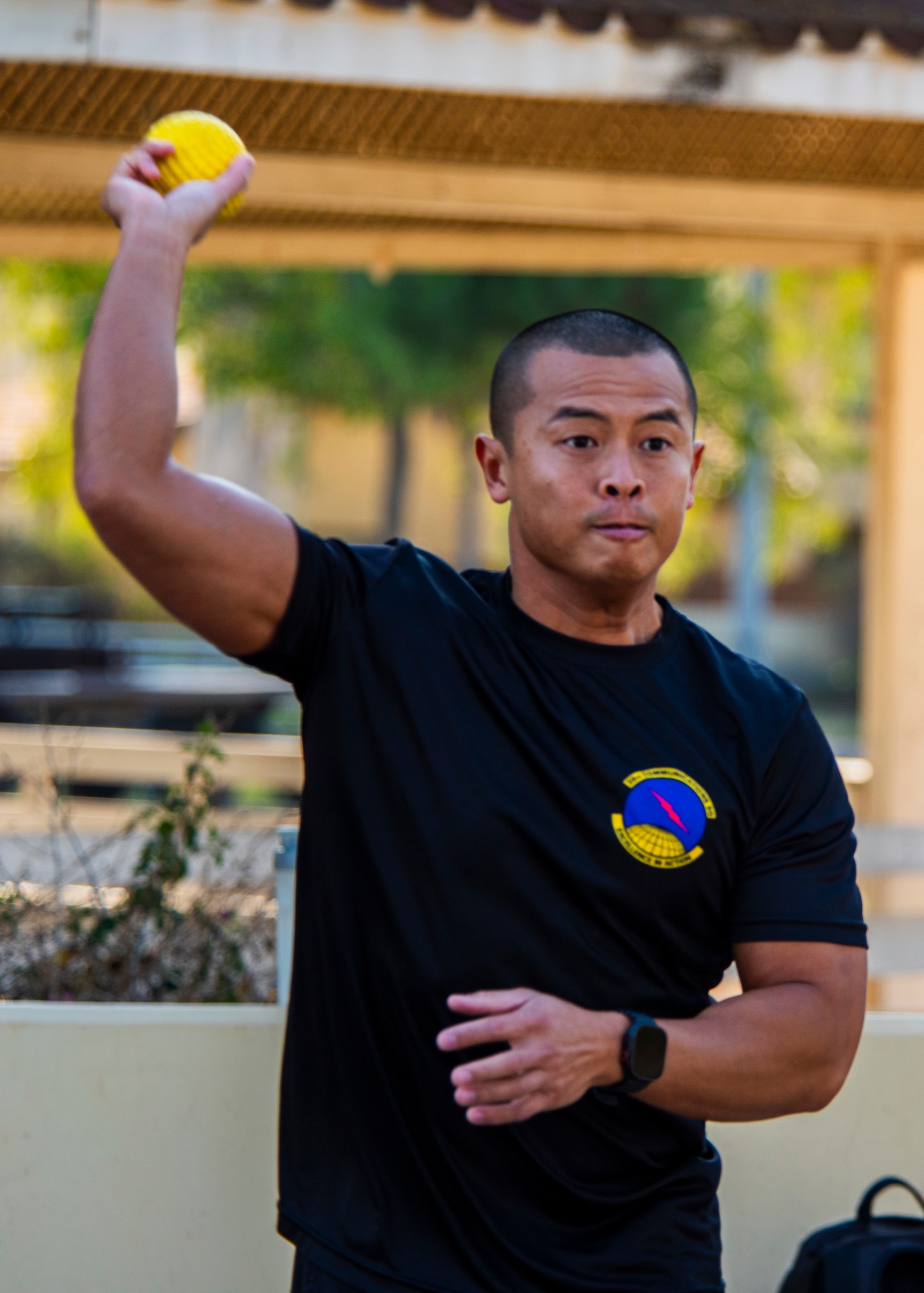 A U.S. service member throws a ball
