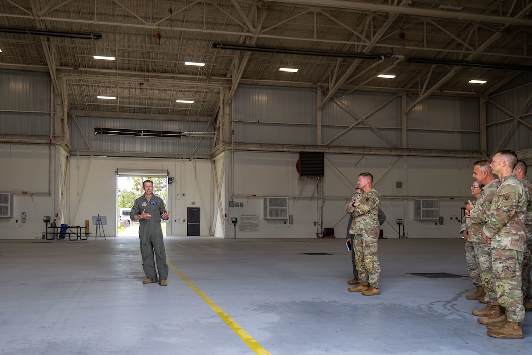 Man addresses an audience.
