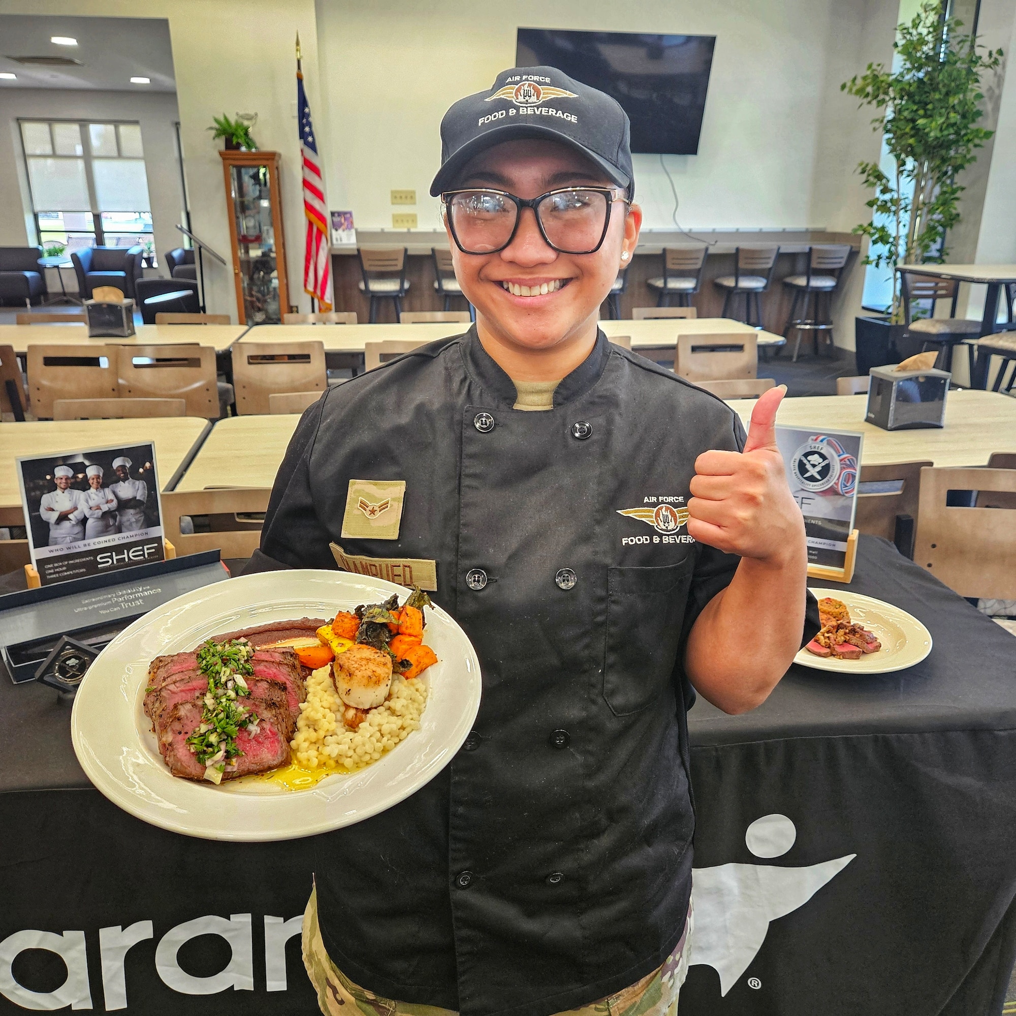U.S. Air Force Airman 1st Class Shanise Caampued, 87th Force Support Squadron chef, showcases her winning plate during the 87th FSS’s Salute Hospitality Epicurean Faceoff in September at Joint Base McGuire-Dix-Lakehurst, New Jersey. Caampued earned first place and will represent JBMDL at the national SHEF competition at the Culinary Institute of America in San Antonio, Texas this week. (U.S. Air Force courtesy photo)