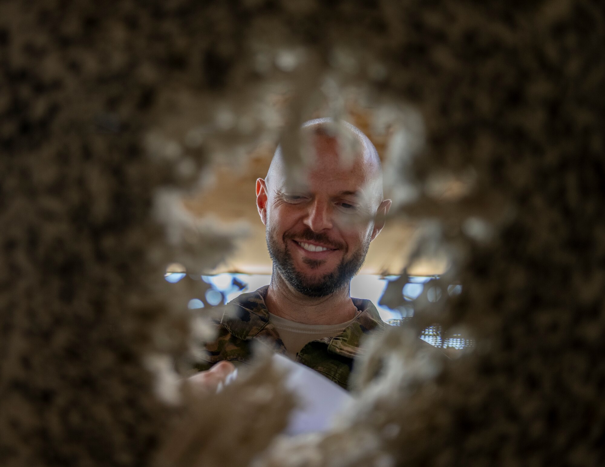 A Spanish service member prepares to place a target