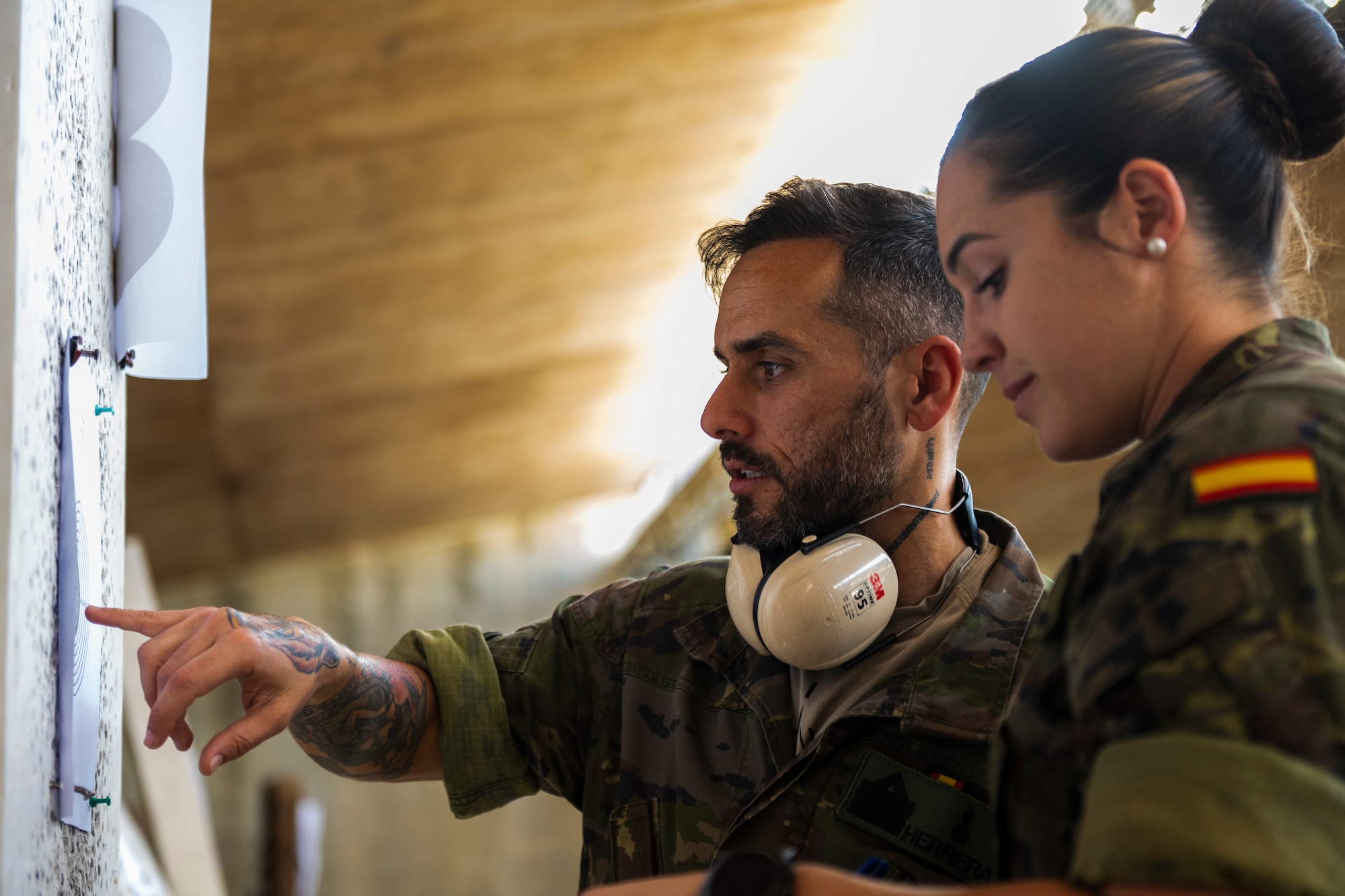 Spanish Army members review shot placement