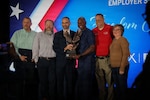 Key guests stand for a group photo at the Employer Support for the Guard and Reserve Freedom Award ceremony in Atlanta, Georgia, October 17, 2025. The Freedom Award recognizes civilian employers who go above and beyond in their support of service members. (U.S. Army photo by Chasity Williams)