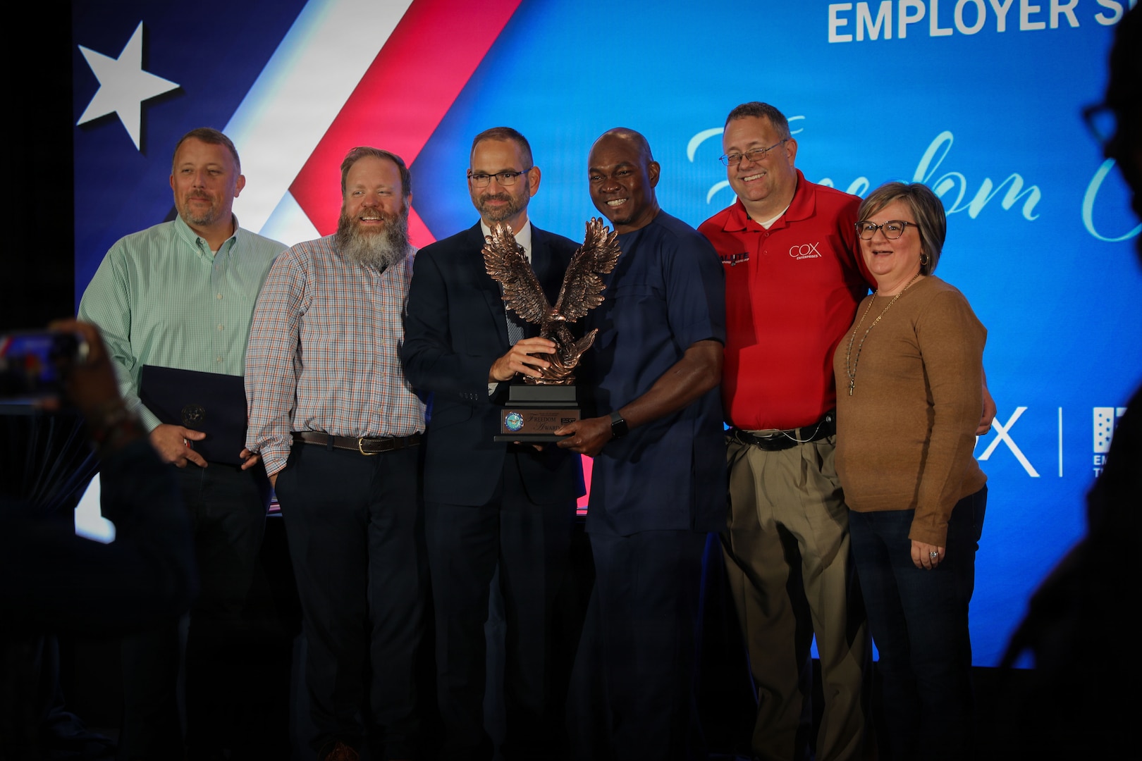 Key guests stand for a group photo at the Employer Support for the Guard and Reserve Freedom Award ceremony in Atlanta, Georgia, October 17, 2025. The Freedom Award recognizes civilian employers who go above and beyond in their support of service members. (U.S. Army photo by Chasity Williams)