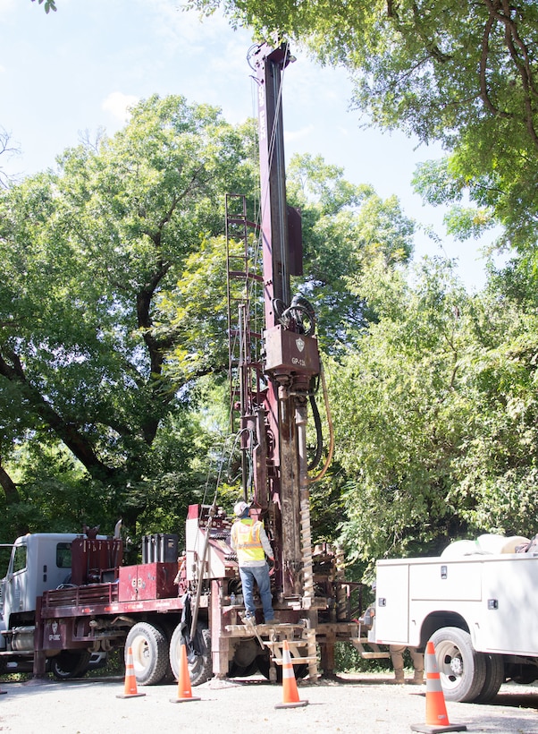 Dallas Spencer, the lead driller and crew chief with the U.S. Army Corps of Engineers' Fort Worth District's Geotechnical Branch, prepares to bore an 8-inch hole into the ground to sample the subsurface earth to determine material composition.