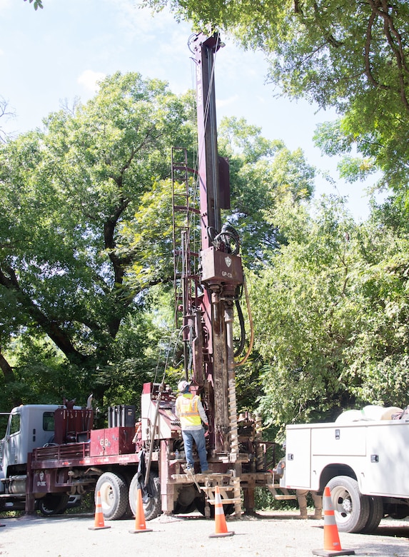 Dallas Spencer, the lead driller and crew chief with the U.S. Army Corps of Engineers' Fort Worth District's Geotechnical Branch, prepares to bore an 8-inch hole into the ground to sample the subsurface earth to determine material composition.