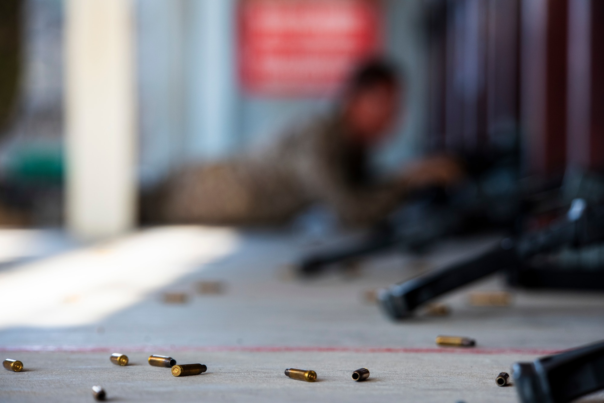 Spent shell casings lay on the ground during a shooting competition
