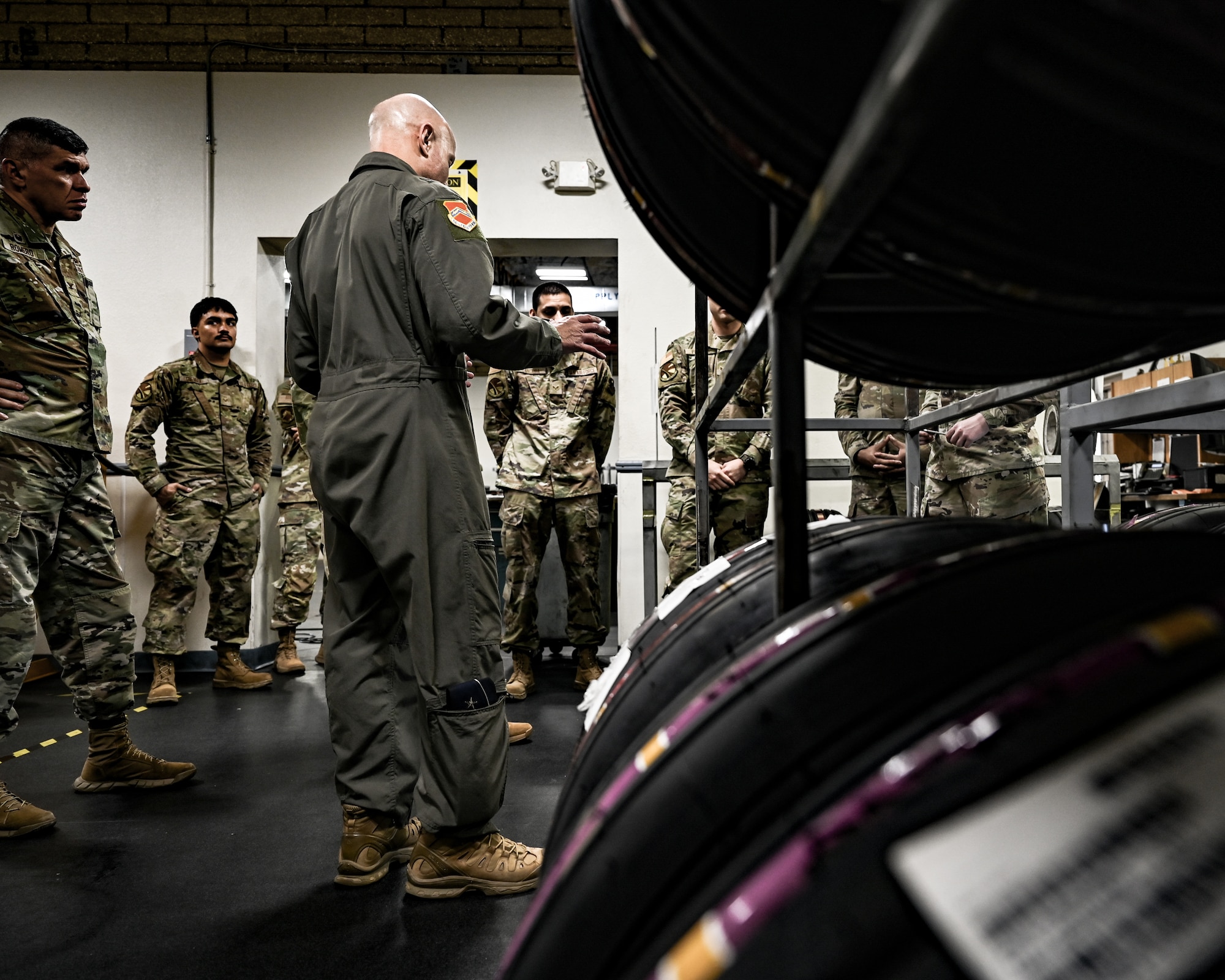U.S. Air Force Brig. Gen. David Berkland, 56th Fighter Wing commander, is briefed by Airmen assigned to the 56th Aircraft Maintenance Squadron