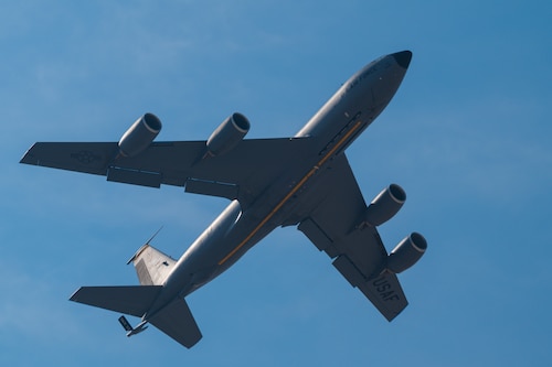 A KC-135 Stratotanker aircaft flies in the blue sky