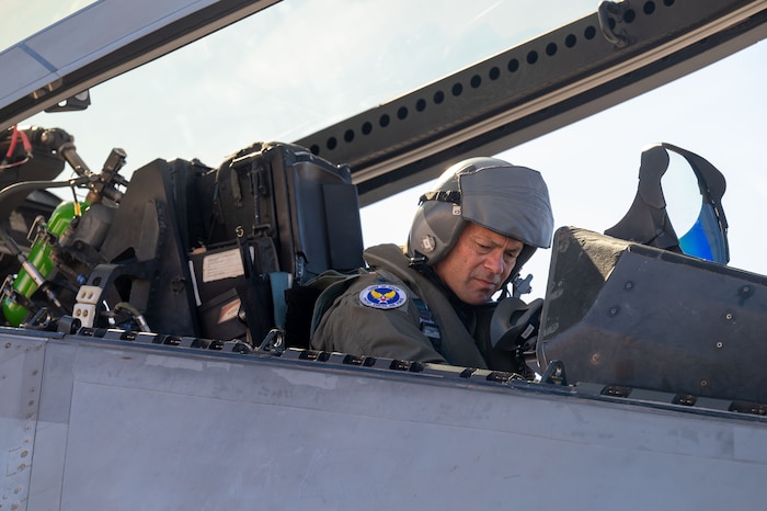 The Chief of Staff of the Air Force performs preflight checks prior to take off.