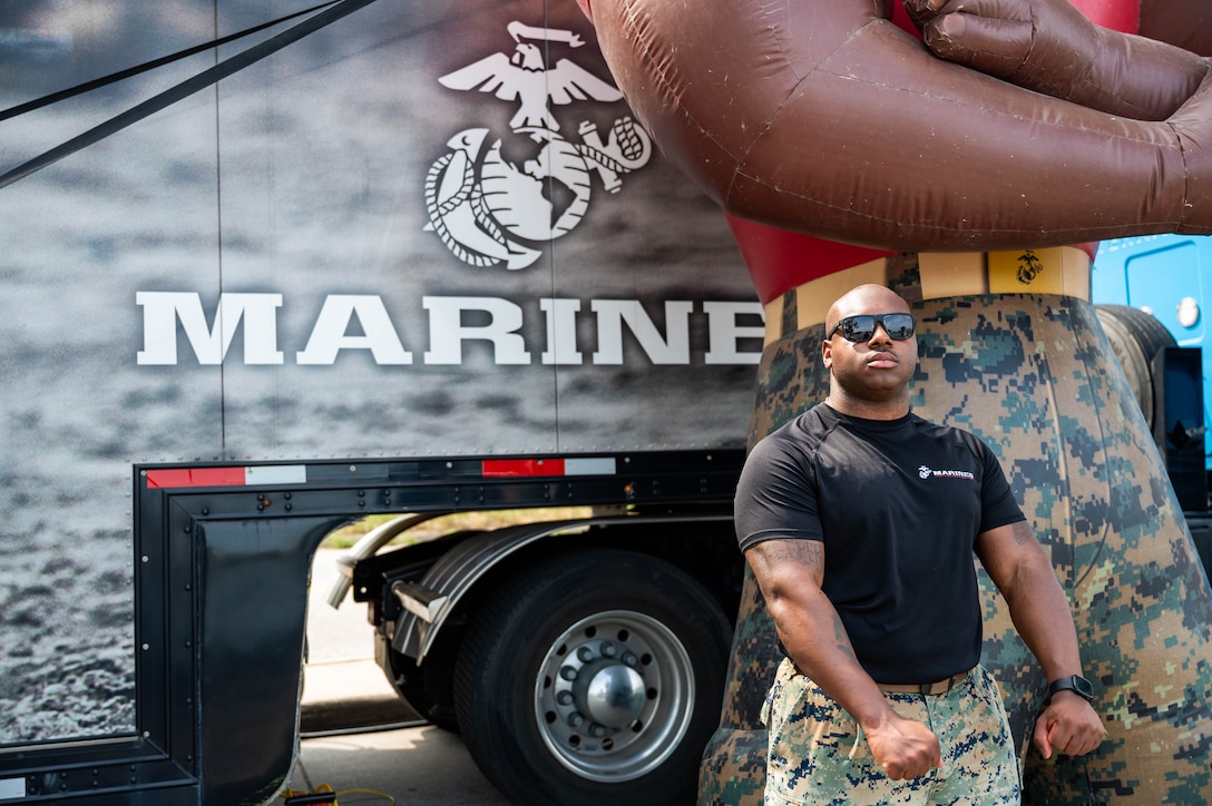 U.S. Marine Corps Sergeant Devin Lang, a recruiter with Recruiting Station Lansing, 4th Marine Corps District, poses for a photo during Coast Guard Festival at Grand Haven, Michigan, July 29, 2025. Coast Guard Festival is an annual event that provides the Marines a juncture to interact with the local community and educate prospects on Marine Corps opportunities. Lang is a native of Hattiesburg, Mississippi. (U.S. Marine Corps photo by Sgt. Israel Sheber)
