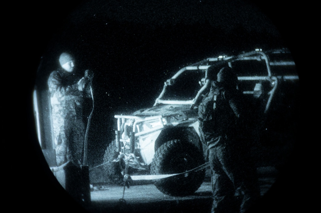 U.S. Marines with Combat Logistics Battalion (CLB) 8, 24th Marine Expeditionary Unit (MEU), secure a Utility Task Vehicle to a flatrack after night helicopter support team operations at  Marine Corps Base Camp Lejeune, North Carolina, Nov. 18, 2025. The 24th MEU is a composite Marine Air-Ground Task Force ready to respond to the nation’s call when needed. (U.S. Marine Corps Photo taken by Cpl. Daniel Childs)