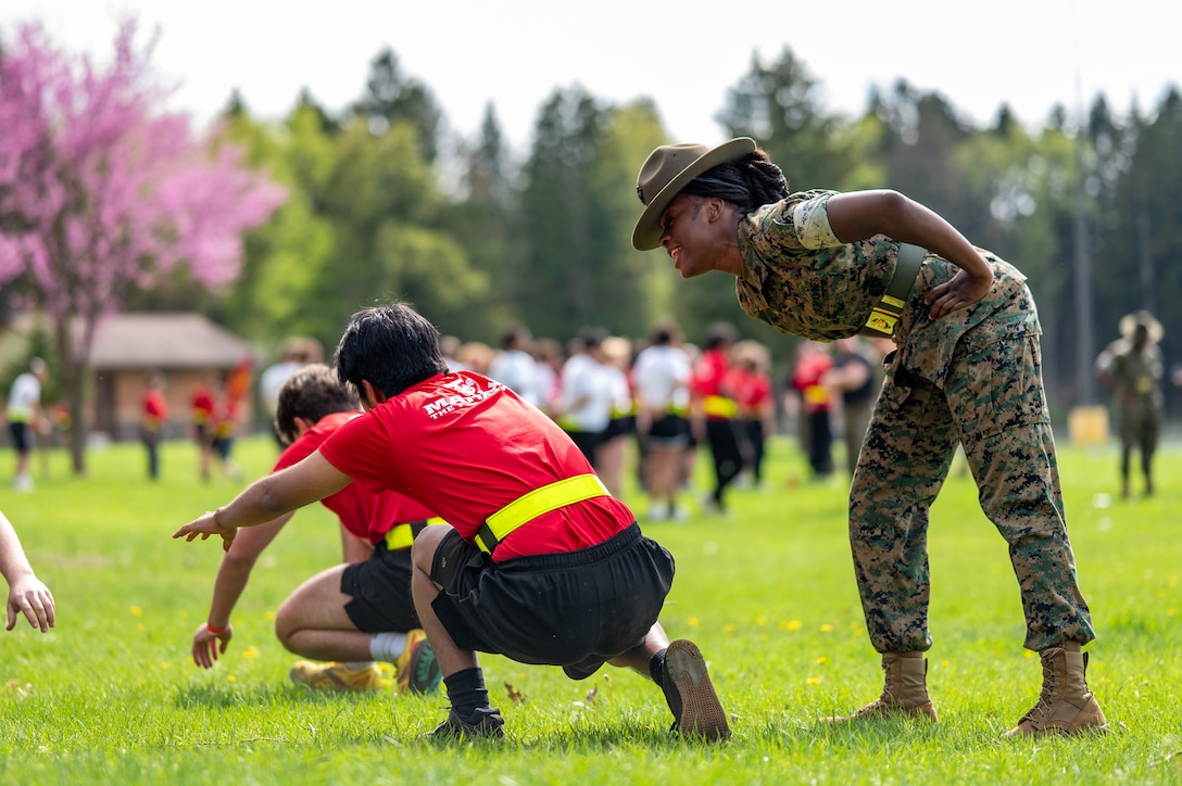 U.S. Marine Corps Sergeant Christina Griffith, a drill instructor with 1st Battalion, Delta Company, Marine Corps Recruit Depot Parris Island, South Carolina provides incentive training to a poolee during Recruiting Station Lansing’s Mini Bootcamp at Fort Custer, Army National Guard Base, Battle Creek, Michigan, on May 3, 2025. Mini Bootcamp was designed to prepare poolees for the rigors of recruit training. Rogers is a native of New Orleans, Louisiana. (U.S. Marine Corps photo by Sgt. Israel Sheber)