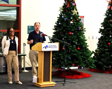 Darin Funk, the incoming executive director of American Gold Star Families, Inc., thanks the organization's president, Frances Maddox, during the American Gold Star Families’ Fallen Heroes Tree of Honor Tree Lighting Ceremony.
