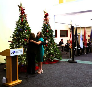 Miss. Kankakee Teen 2025 and Eagle Scout, Alexis McCullough, whose father, Army Col. Mark R. McCullough, died while serving his nation on Oct. 16, 2019, hugs Frances Maddox.
