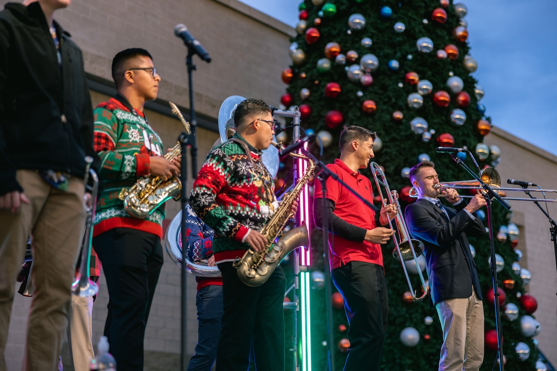 U.S. Marines with the 1st Marine Division Band perform during the annual Tree Lighting Celebration at Marine Corps Base Camp Pendleton, California, Nov. 22, 2025. The event, hosted by Marine Corps Community Services, brings together service members, families, and civilian employees of MCB Camp Pendleton to celebrate the holiday season. (U.S. Marine Corps photo by Lance Cpl. Caitlyn Stone).