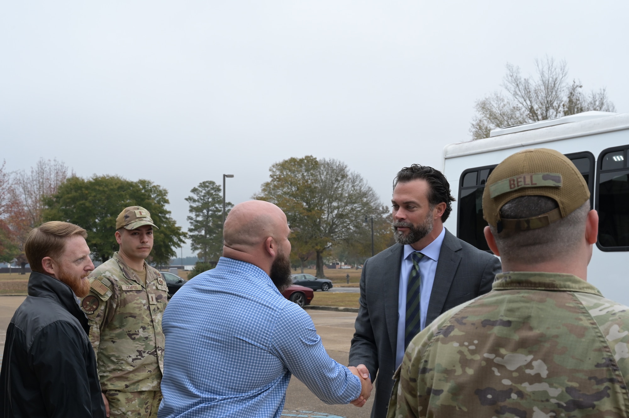 The Under Secretary of the Air Force Matthew Lowmeier greets members of 14th Flying Training Squadron Civil Engineering Squadron