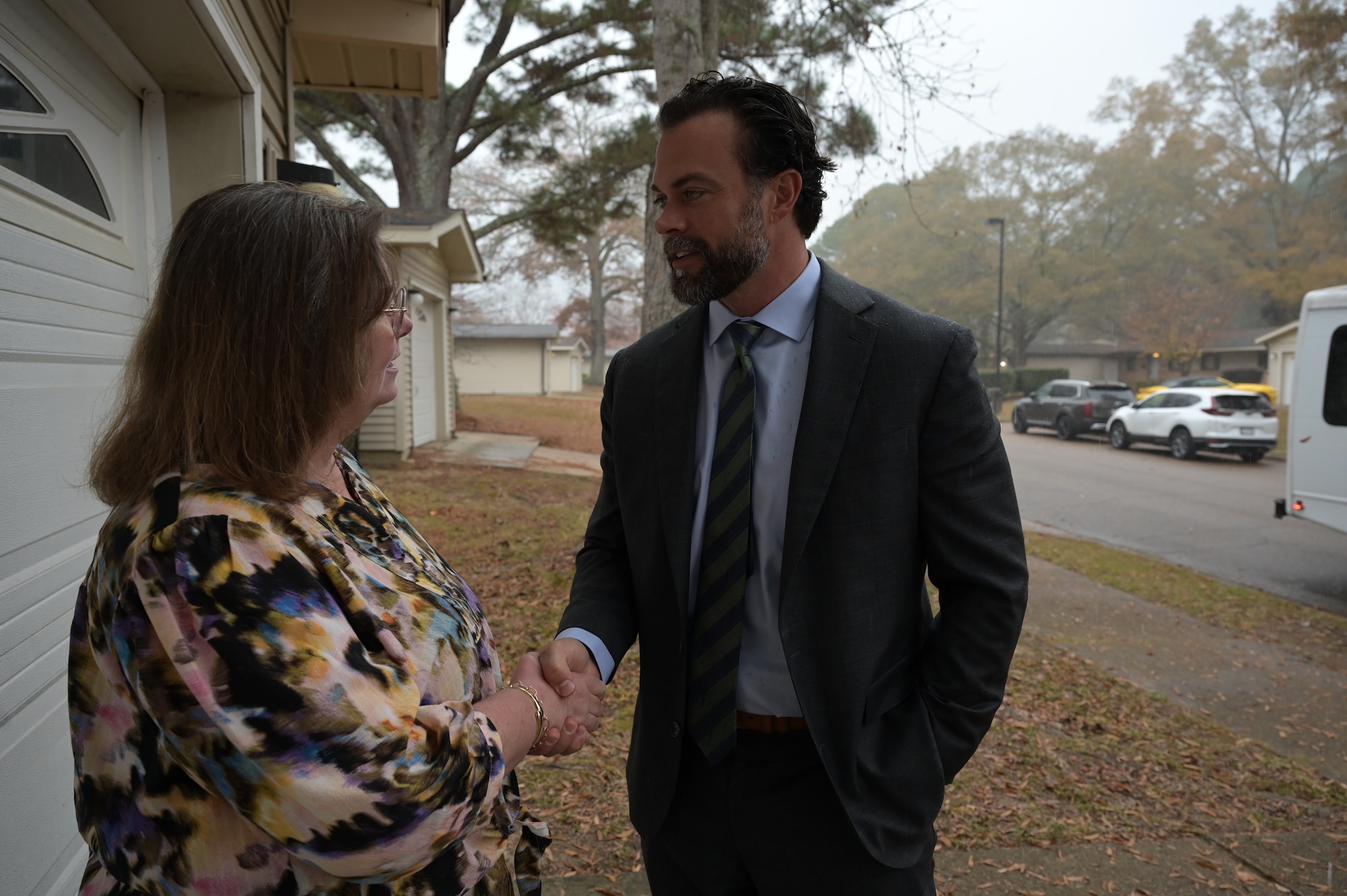 USEAF Matthew Lohmeier greets Ms. Kay Heath.