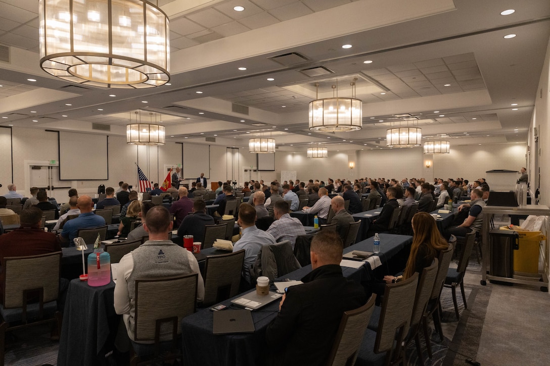U.S. Marines assigned to the Marine Innovation Unit listen to remarks from Brig. Gen. David K. Winnacker, commanding general, and Sergeant Major Russell D. Boley, command senior enlisted leader, Force Headquarters Group, Marine Forces Reserve, during a town hall meeting in White Plains, New York, Nov. 20, 2025. During the town hall, Winnacker and Sergeant Major Boley delivered remarks and answered questions from the Marine Innovation Unit. Established in 2022, the Marine Innovation Unit leverages the talent of the Marine Corps Reserve to accelerate the adoption of advanced capabilities, transform Naval Service capacity for technology employment, and retain and invest in Total Force human capital. (U.S. Marine Corps photo by Cpl. Kanoa Thomas)