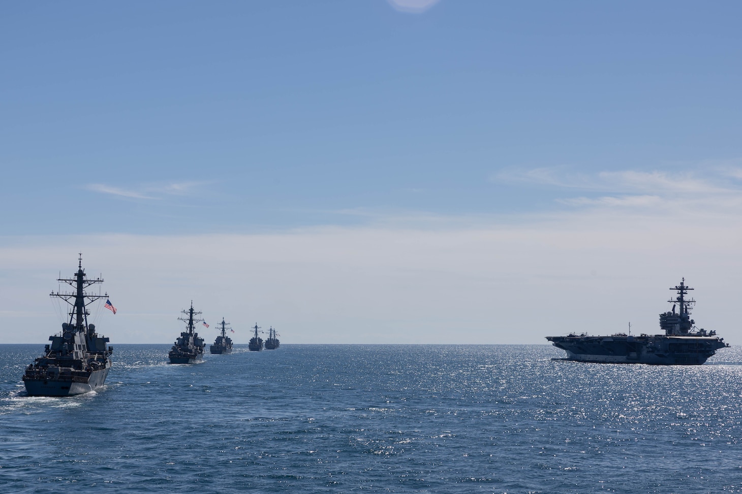 Six Arleigh Burke-class guided-missile destroyers prepare for a live fire shoot during the Titans of the Sea Presidential Review aboard the Nimitz-class aircraft carrier USS George H.W. Bush (CVN 77). The Titans of the Sea Presidential Review is one of many events taking place throughout the country to showcase maritime capabilities as part of the U.S Navy’s 250th birthday. America is a maritime nation. For 250 years, America’s Warfighting Navy has sailed the globe in defense of freedom.
