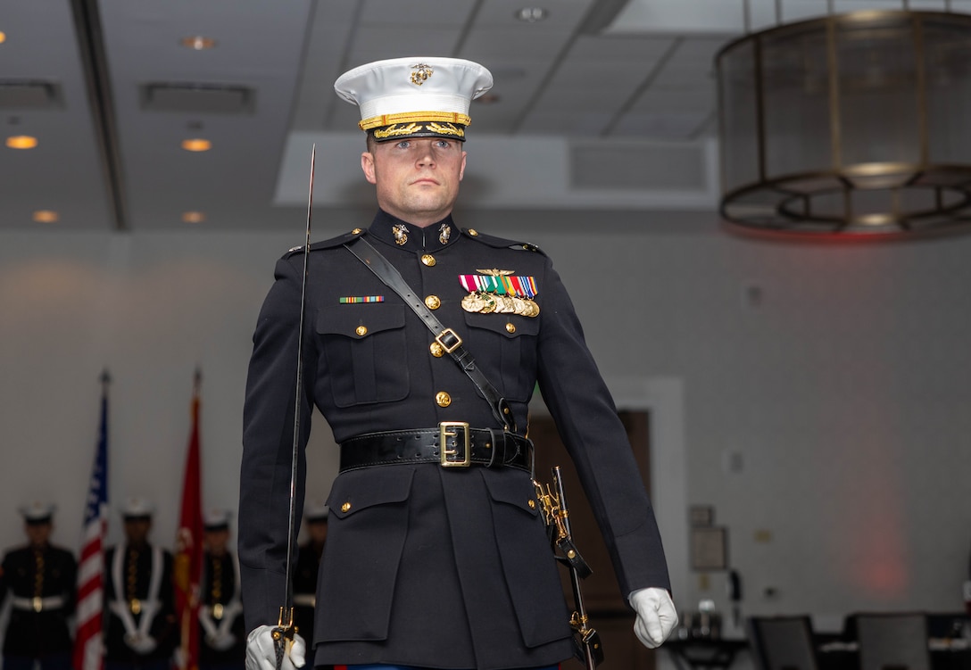 U.S. Marine Corps Lt. Col. Phillip Smith, assigned to the Marine Innovation Unit, marches during the unit’s 250th Marine Corps Birthday Ball in White Plains, New York, Nov, 21, 2025. The birthday ball took place at the conclusion of MIU’s annual week-long training period, establishing objectives and plans for the coming year. Established in 2022, the Marine Innovation Unit leverages the talent of the Marine Corps Reserve to accelerate the adoption of advanced capabilities, transform Naval Service capacity for technology employment, and retain and invest in Total Force human capital. (U.S. Marine Corps photo by Cpl. Kanoa Thomas)