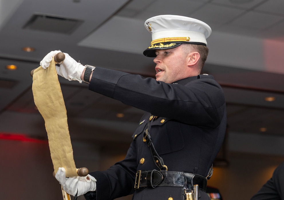 U.S. Marine Corps Lt. Col. Phillip Smith, assigned to the Marine Innovation Unit, reads Gen. John A. Lejeune’s birthday message during the unit’s 250th Marine Corps Birthday Ball in White Plains, New York, Nov. 21, 2025. The birthday ball took place at the conclusion of MIU’s annual week-long training period, establishing objectives and plans for the coming year. Established in 2022, the Marine Innovation Unit leverages the talent of the Marine Corps Reserve to accelerate the adoption of advanced capabilities, transform Naval Service capacity for technology employment, and retain and invest in Total Force human capital. (U.S. Marine Corps photo by Cpl. Kanoa Thomas)