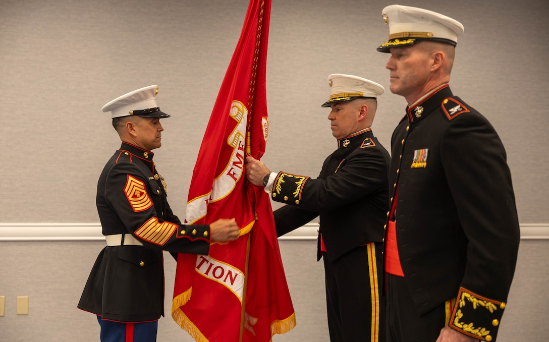 U.S. Marine Corps Master Gunnery Sgt. David A. Arellano passes the unit colors to Col. Brooks D. Braden during the Marine Innovation Unit’s change of command ceremony in White Plains, New York, Nov. 21, 2025. During the ceremony, Col. Benjamin C. Richardson assumed command of the Marine Innovation Unit from Braden. Established in 2022, the Marine Innovation Unit leverages the talent of the Marine Corps Reserve to accelerate the adoption of advanced capabilities, transform Naval Service capacity for technology employment, and retain and invest in Total Force human capital. (U.S. Marine Corps photo by Cpl. Kanoa Thomas)