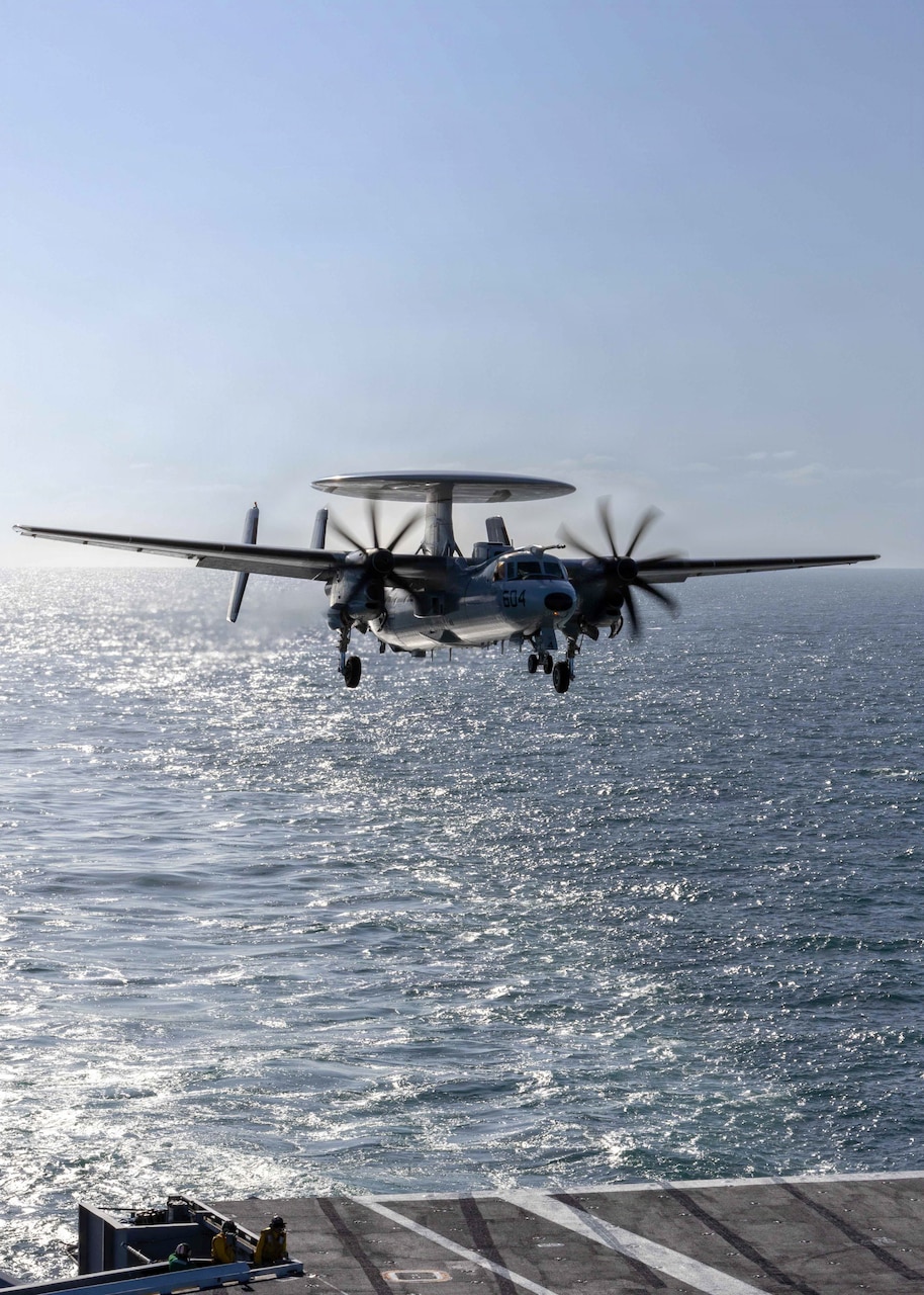 An E-2D Hawkeye attached to the “Seahawks” of Carrier Air Wing (VAW) 126 prepares to performs a touch-and-go landing aboard the Nimitz-class aircraft carrier USS George H.W. Bush (CVN 77) in preparation for the Titans of the Sea Presidential Review. The Titans of the Sea Presidential Review is one of many events taking place throughout the country to showcase maritime capabilities as part of the U.S. Navy’s 250th birthday. America is a maritime nation. For 250 years, America’s Warfighting Navy has sailed the globe in defense of freedom. U.S. Navy photo by MCSN Abigail Reyes
