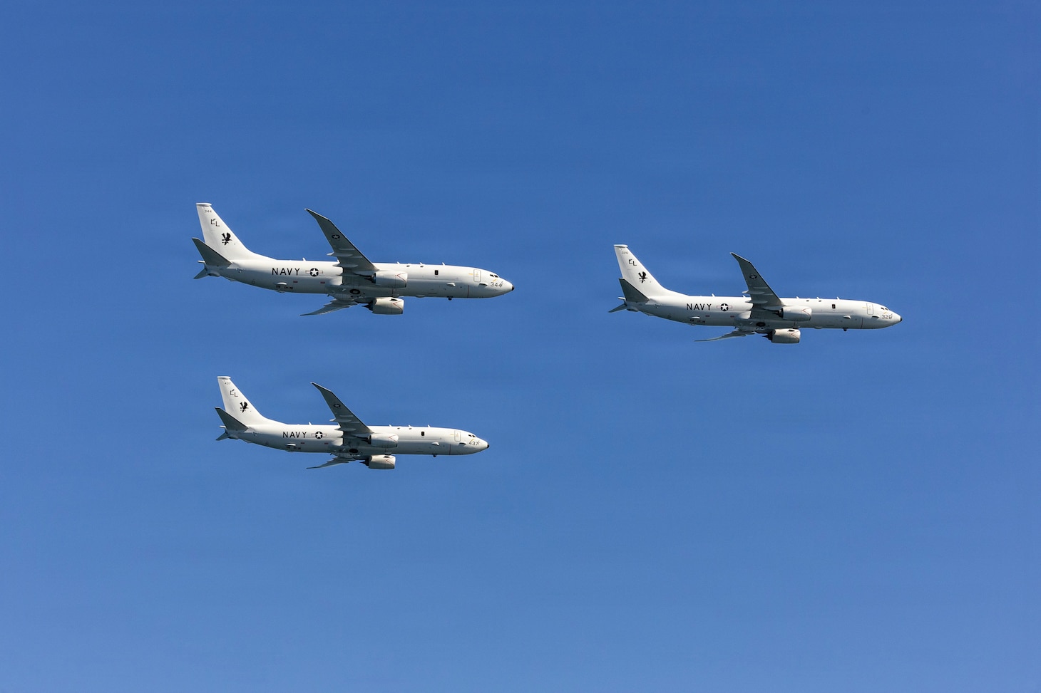 Three P-8 Poseidons flyover the Nimitz-class aircraft carrier USS George H.W. Bush (CVN 77) in preparation for the Titans of the Sea Presidential Review. The Titans of the Sea Presidential Review in one of many events taking place throughout the country to showcase maritime capabilities as part of the U.S Navy's 250th birthday. America is a maritime nation. For 250 years, America's Warfighting Navy ha sailed the globe in defense of freedom.