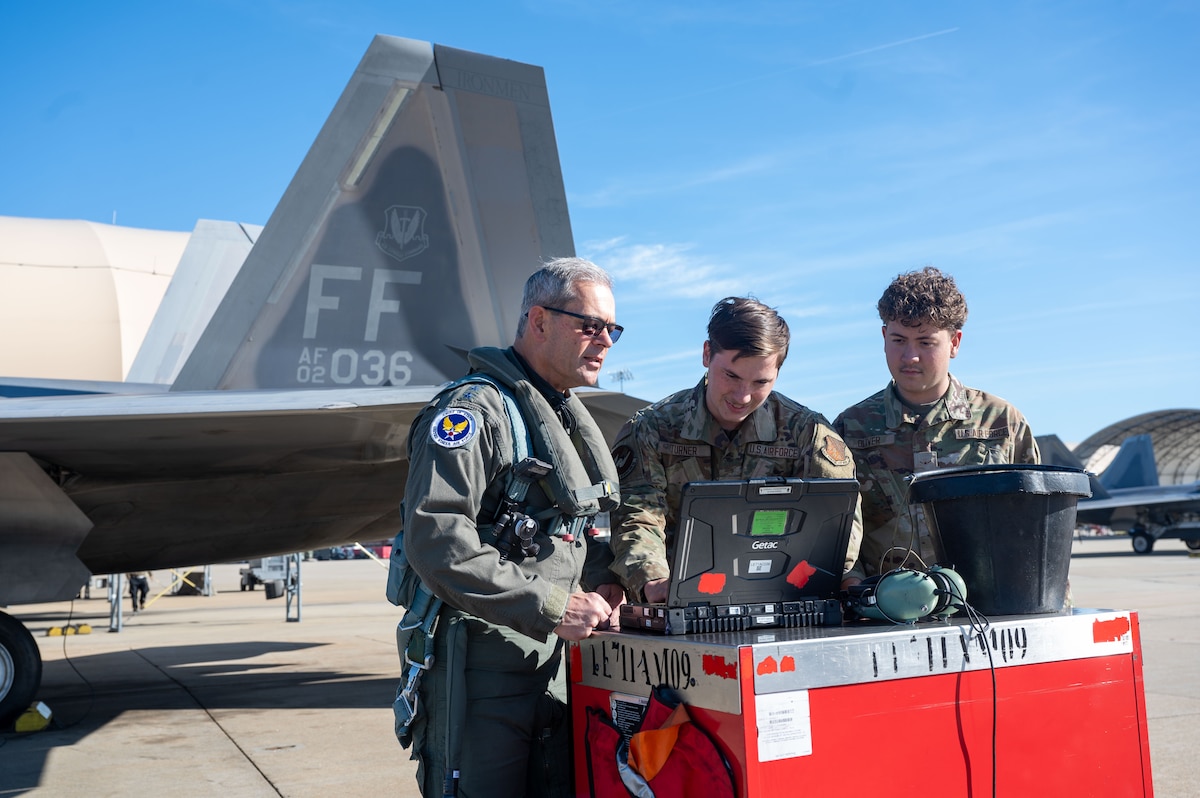 Airmen perform preflight chief on an aircraft.