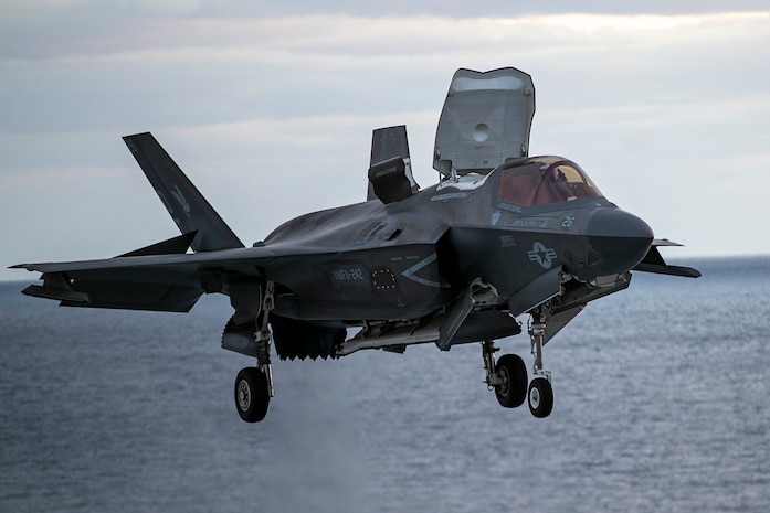 An F-35B Lighting II, assigned to Marine Fighter Attack Squadron 242, lands on the flight deck during flight operations aboard the forward-deployed amphibious assault carrier USS Tripoli (LHA 7), Nov. 28, 2025.