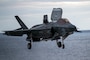An F-35B Lighting II, assigned to Marine Fighter Attack Squadron 242, lands on the flight deck during flight operations aboard the forward-deployed amphibious assault carrier USS Tripoli (LHA 7), Nov. 28, 2025.