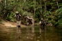 U.S. Marines with 7th Communication Battalion, III Marine Expeditionary Force Information Group, patrol on an obstacle course during Operation Odyssey Stormbreaker III at Jungle Warfare Training Center, Okinawa, Japan, Nov. 4, 2025.