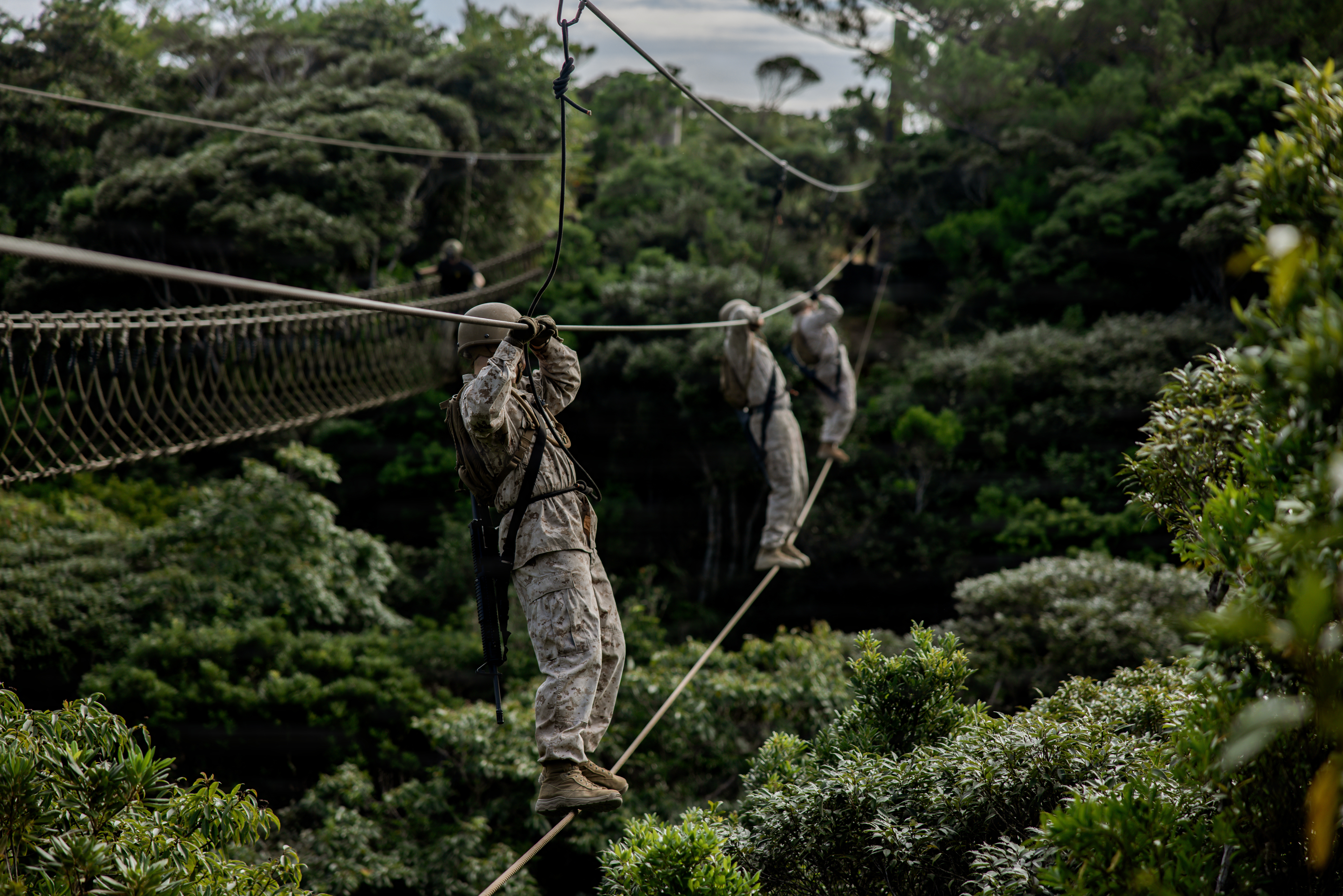 U.S. Marines with 7th Communication Battalion, III Marine Expeditionary Force Information Group, conduct an obstacle course during Operation Odyssey Stormbreaker III at Jungle Warfare Training Center, Okinawa, Japan, Nov. 4, 2025.