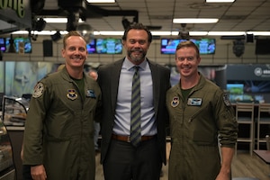 U.S. Air Force Capt. Tyler “Hype” Lannom, instructor pilot 49th Flying Training Squadron (left), the Under Secretary of the Air Force Matthew Lohmeier (middle), and U.S. Air Force Lt. Col. John “Rowdy” Little, 49th FTS commander (right), stand together for a group photo at the bowling center