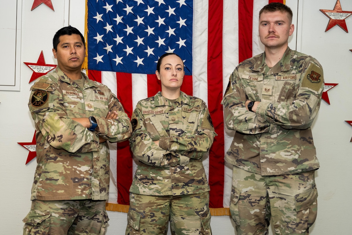 U.S. Air Force Master Sgt. Homer Resendez, left, 9th Expeditionary Bomb Squadron loading element section chief and project officer, Master Sgt. Marla Briscoe-Deroo, center, 9th EBS first sergeant, and Staff Sgt. Trevor Devine, 9th EBS aviation resource management noncommissioned officer in charge, pose for a photo at Misawa Air Base, Japan, Oct. 22, 2025. Throughout Bomber Task Force 26-1, Resendez, Briscoe-Deroo and Devine filled positions focusing on the logistical support and quality-of-life improvements for Airmen assigned to the 9th EBS. (U.S. Air Force photo by Airman 1st Class Adrien Tran)