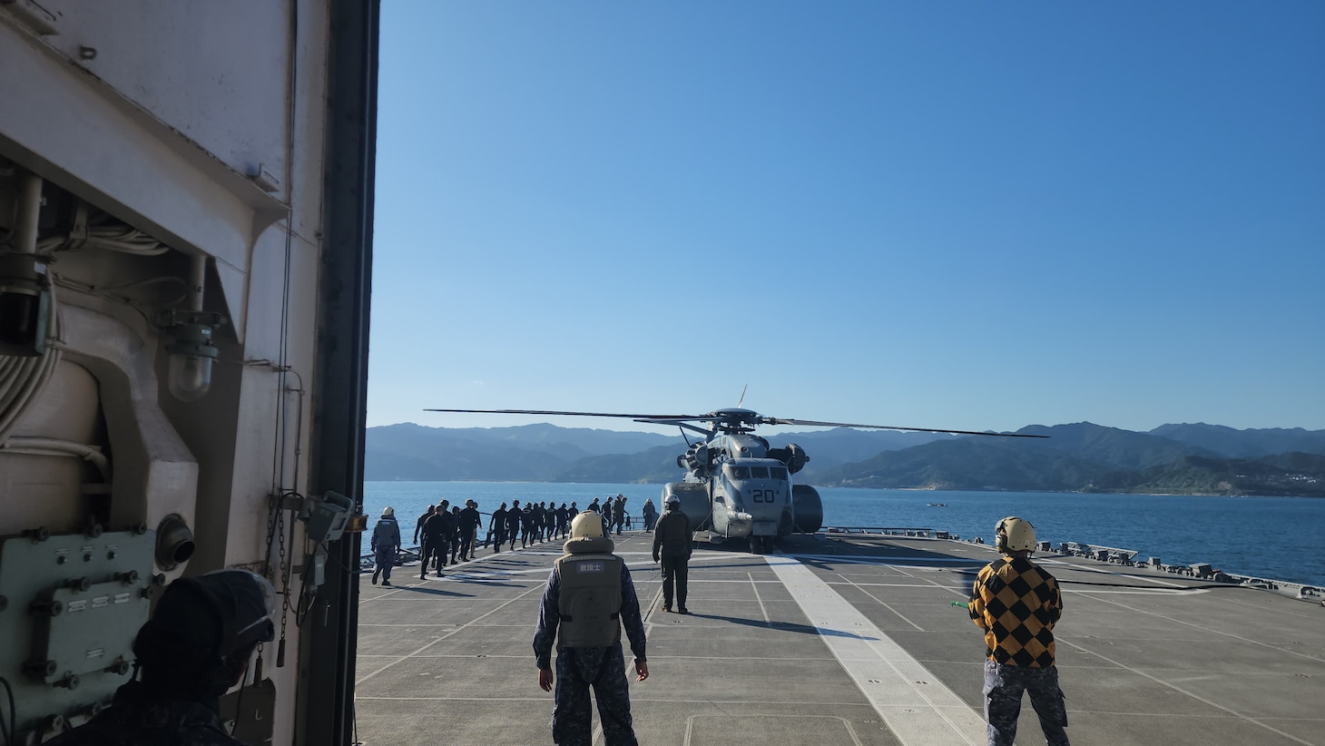 Explosive Ordnance Disposal Mobile Unit (EODMU) 5  Expeditionary Mine Countermeasures (ExMCM) Company 9-3 and Japan Maritime Self-Defense Force (JMSDF) EOD teams board an MH-53E Sea Dragon from Helicopter Mine countermeasures squadron 15 (HM-15) to conduct helicopter casting training during Mine Warfare Exercise (MINEX) 3JA near Aburatsu, Japan, Nov. 22, 2025.