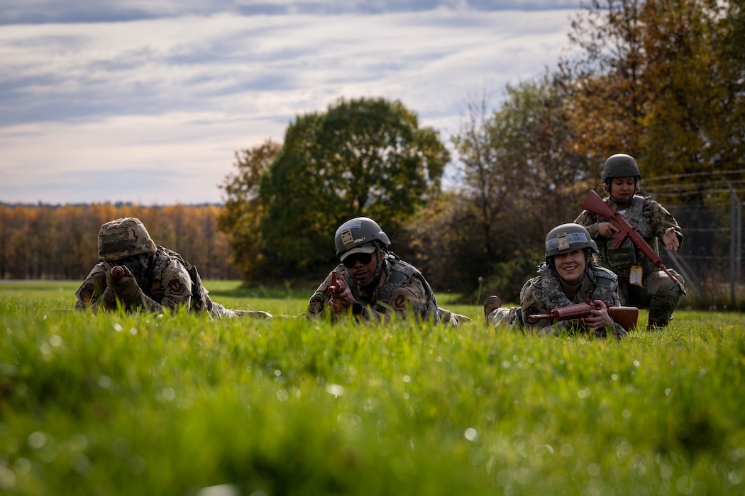 U.S. Air Force Airmen assigned to the 52nd Fighter Wing learn tactical movement drills during the first Airman Leadership School field training exercise at Spangdahlem Air Base, Germany, Nov. 6, 2025. The exercise encouraged students to foster confidence and leadership development in a dynamic, team focused environment. (U.S. Air Force photo by Airman 1st Class Sydney Franklin)
