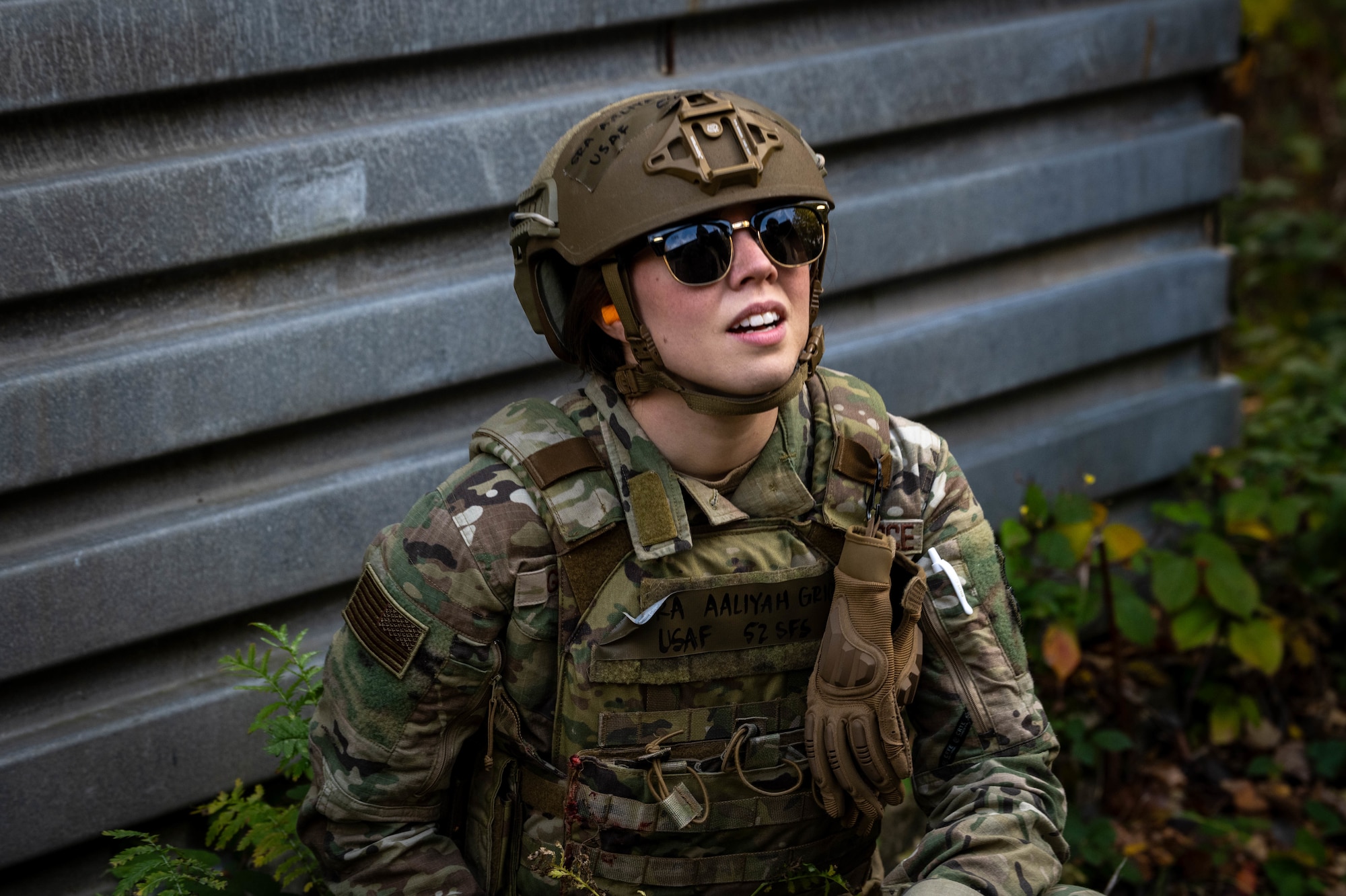 U.S. Air Force Senior Airman Aaliyah Griggs, 52nd Security Forces Squadron small unmanned aircraft systems program manager, listens to directions during the first Airman Leadership School field training exercise at Spangdahlem Air Base, Germany, Nov. 6, 2025. Griggs took part in a squad based scenario that required participants to react quickly and rely on each other to complete their objective. (U.S. Air Force photo by Airman 1st Class Sydney Franklin)
