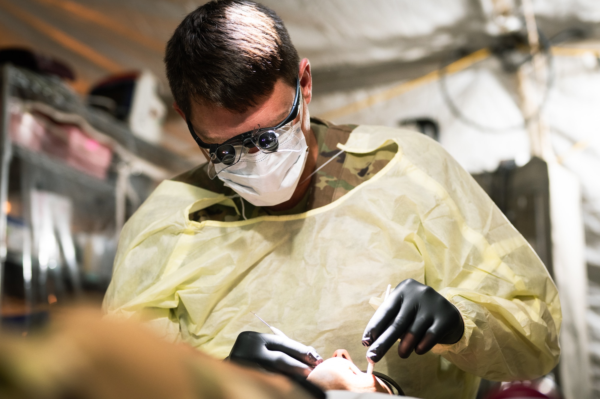 U.S. Air Force Staff Sgt. Miguel Guajardo, 378th EMDS dental clinic non-commissioned officer in charge, prepares utensils to be sterilized