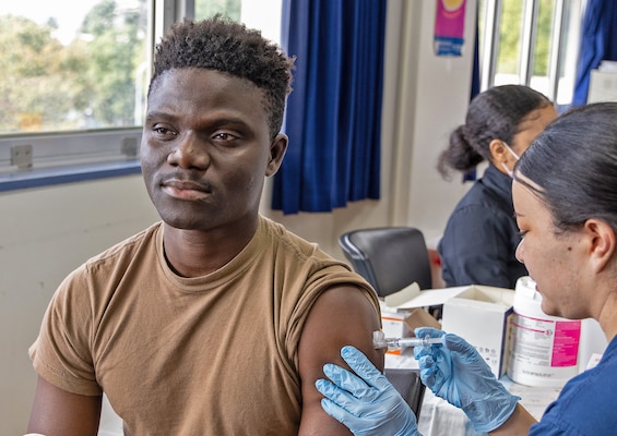 YOKOSUKA, Japan (Oct. 3, 2025) – A U.S. Naval Hospital (USNH) Yokosuka Hospital Corpsman receives an influenza vaccine in the hospital’s Command Auditorium as part of the 2025 influenza vaccination season. Over the course of the 2025 flu shot events, USNH Yokosuka’s vaccination teams administered more than 6,800 doses, efficiently protecting thousands across the installation. The hospital’s annual campaign strengthens medical readiness and protects the health of Sailors, families, and civilian staff. (U.S. Navy photo by USNMRTC Yokosuka Public Affairs/Daniel Taylor)