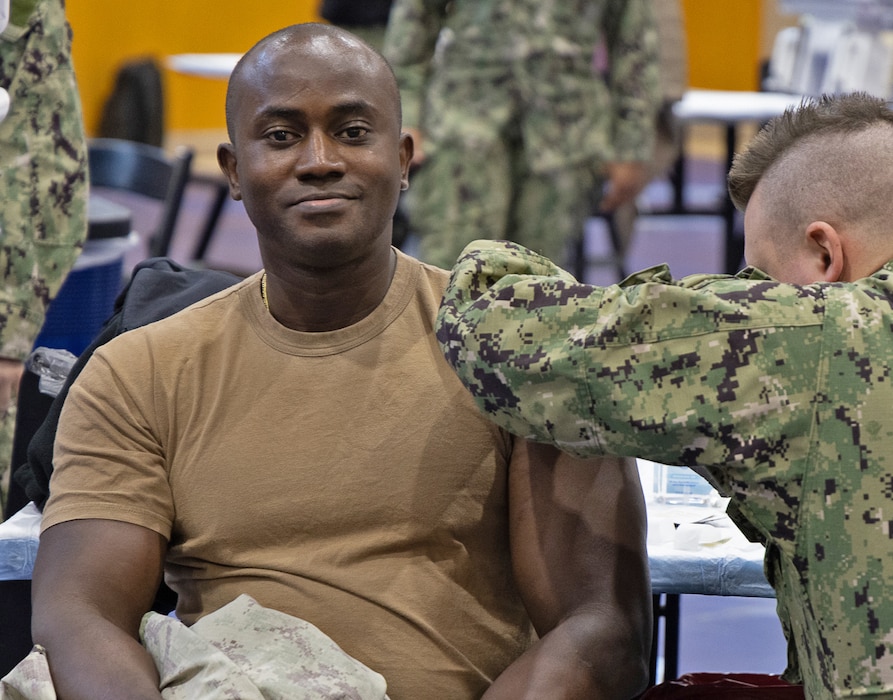 YOKOSUKA, Japan (Oct. 23, 2025) – A Sailor receives an influenza vaccine during a mass vaccination event at the Fleet Recreation Center Gym on Commander, Fleet Activities Yokosuka. Over the course of the 2025 flu shot events, USNH Yokosuka’s vaccination teams administered more than 6,800 doses, efficiently protecting thousands across the installation. The hospital’s annual campaign strengthens medical readiness and protects the health of Sailors, families, and civilian staff. (U.S. Navy photo by USNMRTC Yokosuka Public Affairs/Daniel Taylor)